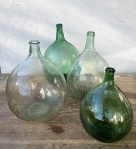 Location mariage bonbonne verre Dame Jeanne verte transparentes accessoires décoration